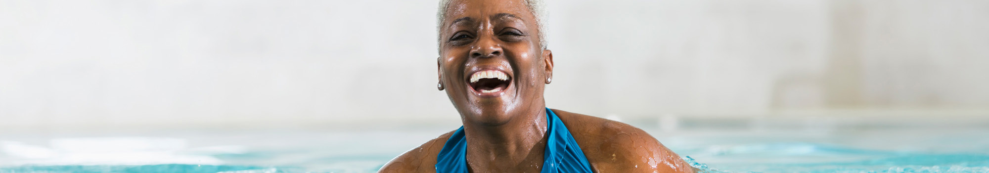 Senior Woman Laughing In Pool